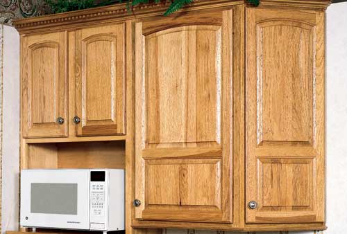 Detail showing Haas Hickory Cabinets with arch.