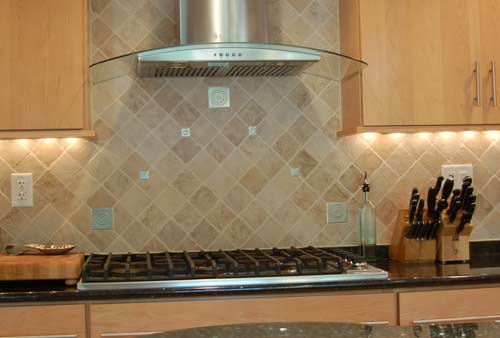 Cooktop and hood with ceramic tile backsplash