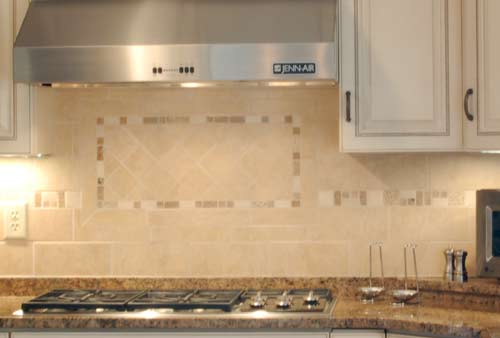Ceramic tile backsplash by A ReMARKable Kitchen Store.